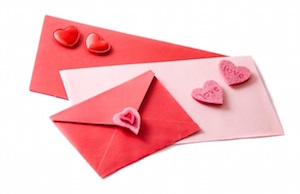 Three envelopes decorated with hearts